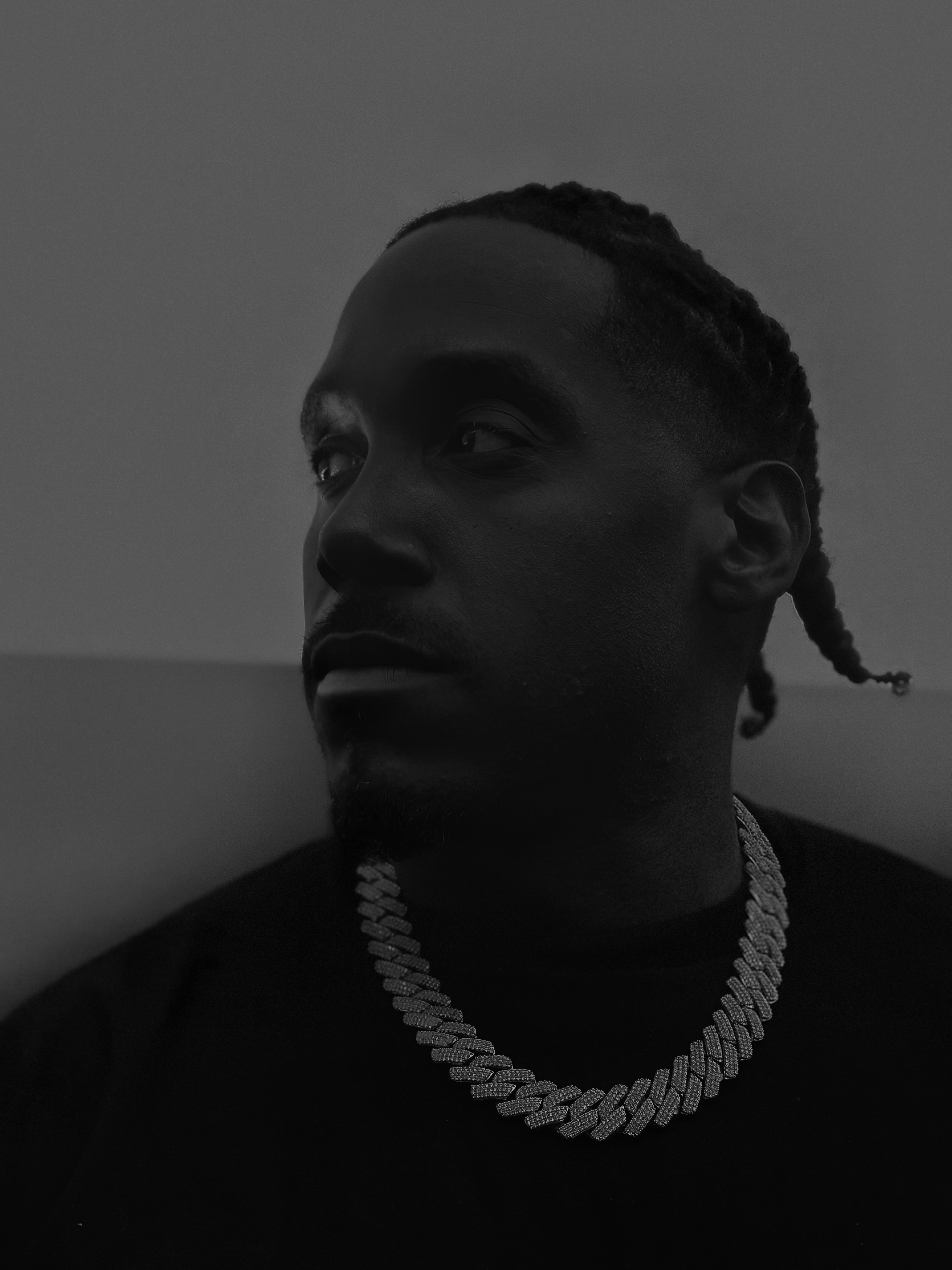Lee Ali black and white close-up portrait, focused and determined